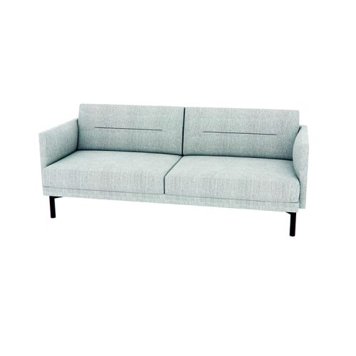 A light blue couch elegantly positioned in a cozy living room setting.