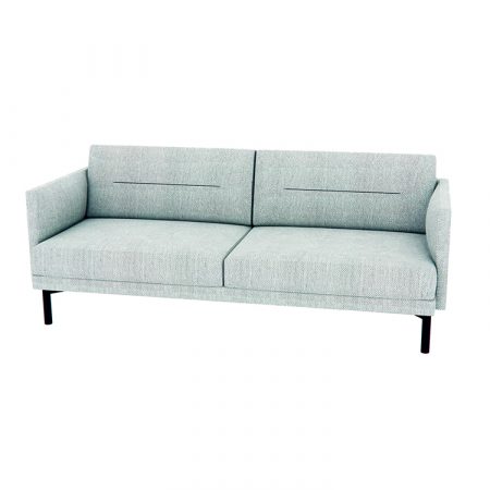 A light blue couch elegantly positioned in a cozy living room setting.