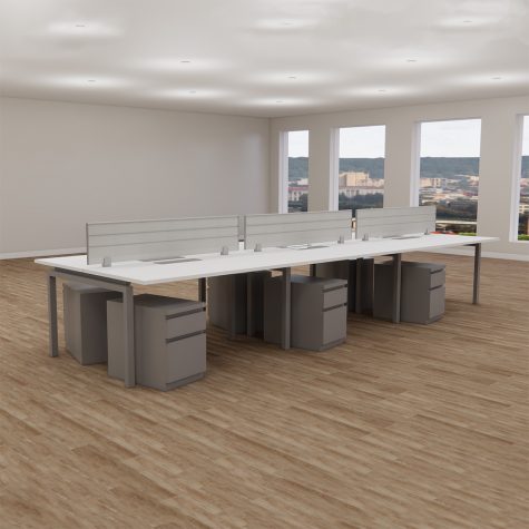 A spacious open office featuring multiple desks and chairs arranged for collaborative work.