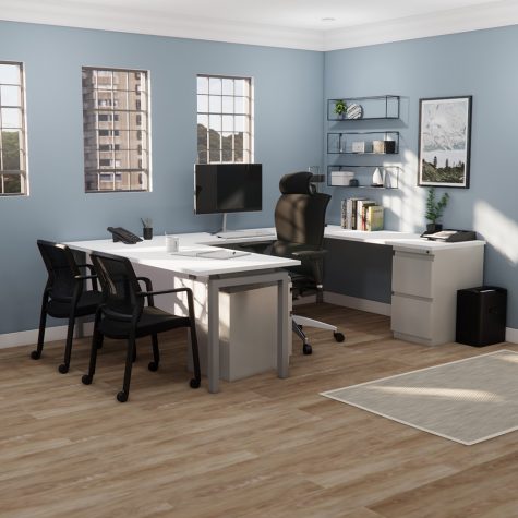 A cozy home office featuring blue walls and warm wood floors, creating a serene and inviting workspace atmosphere.